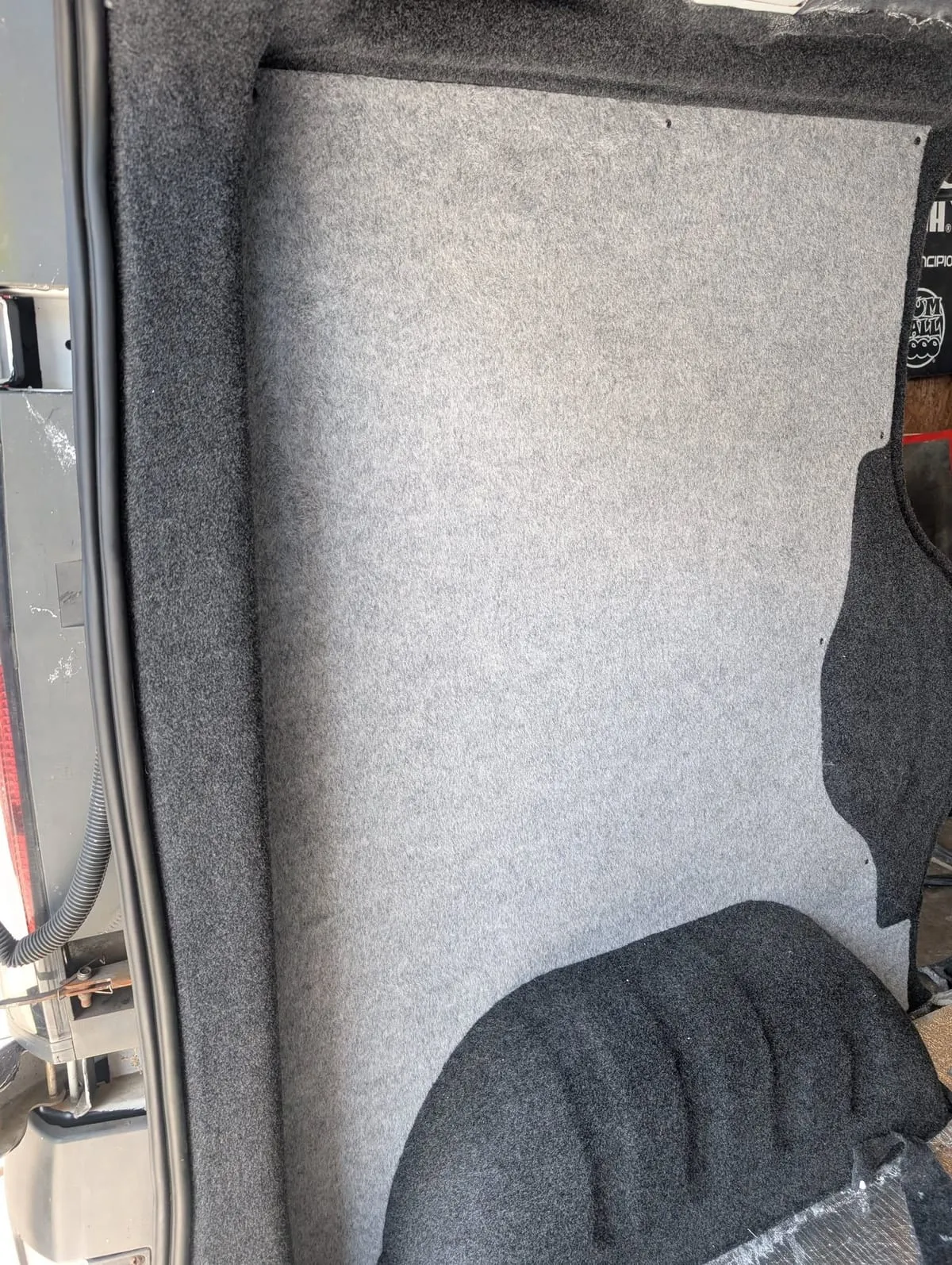 Carpet-lined van panel showing lining and insulation