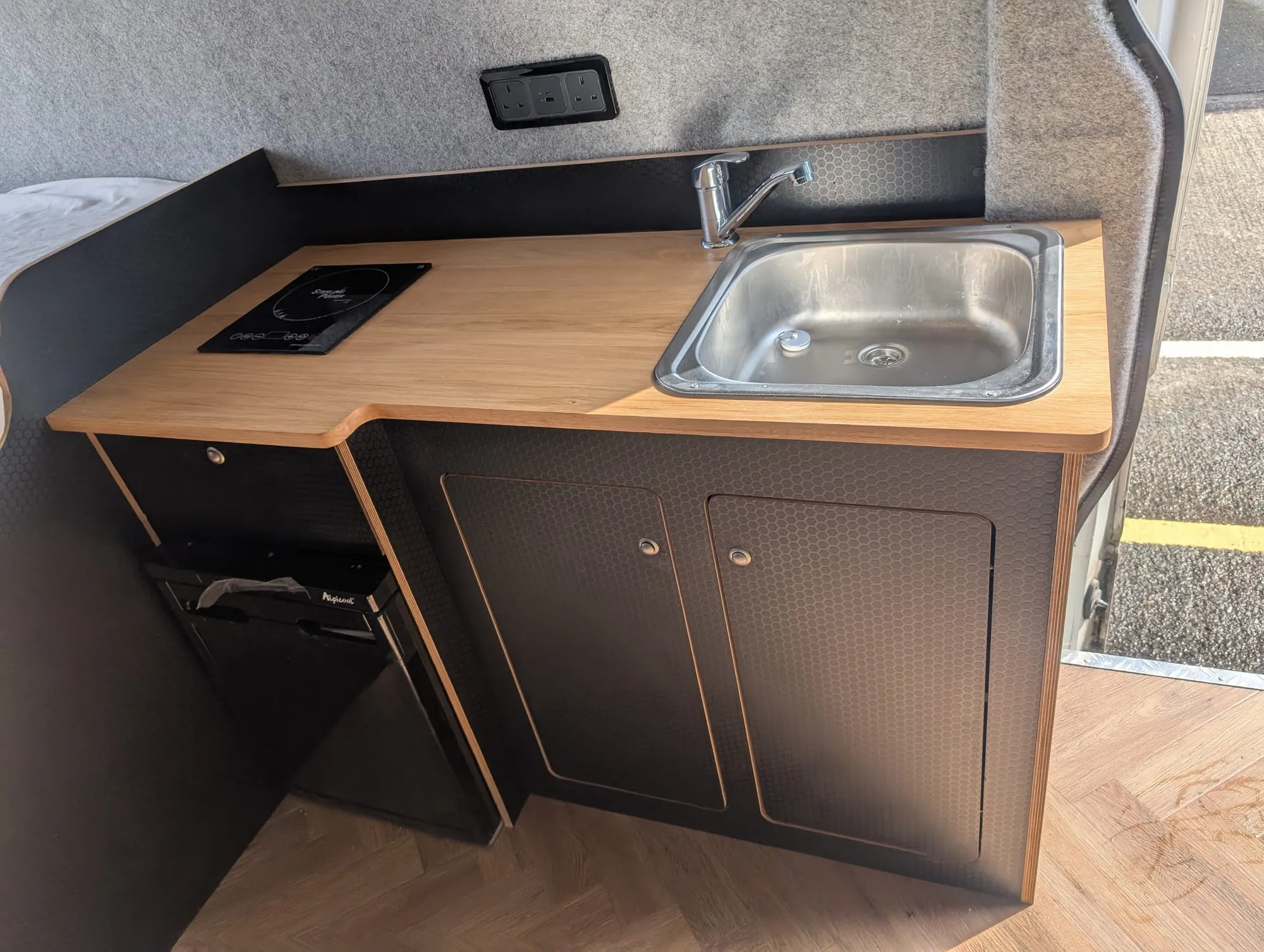Campervan kitchen unit with sink and hob